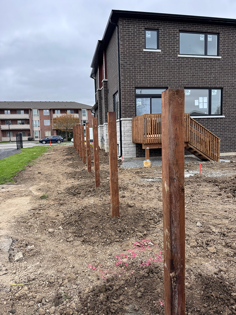 Deck post installation site in Toronto showing properly set Sonotube footer for residential deck construction project
